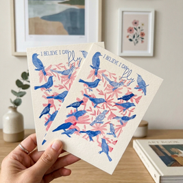 Deux affiches illustrées I Believe I Can Fly avec oiseaux bleus et feuillage rose