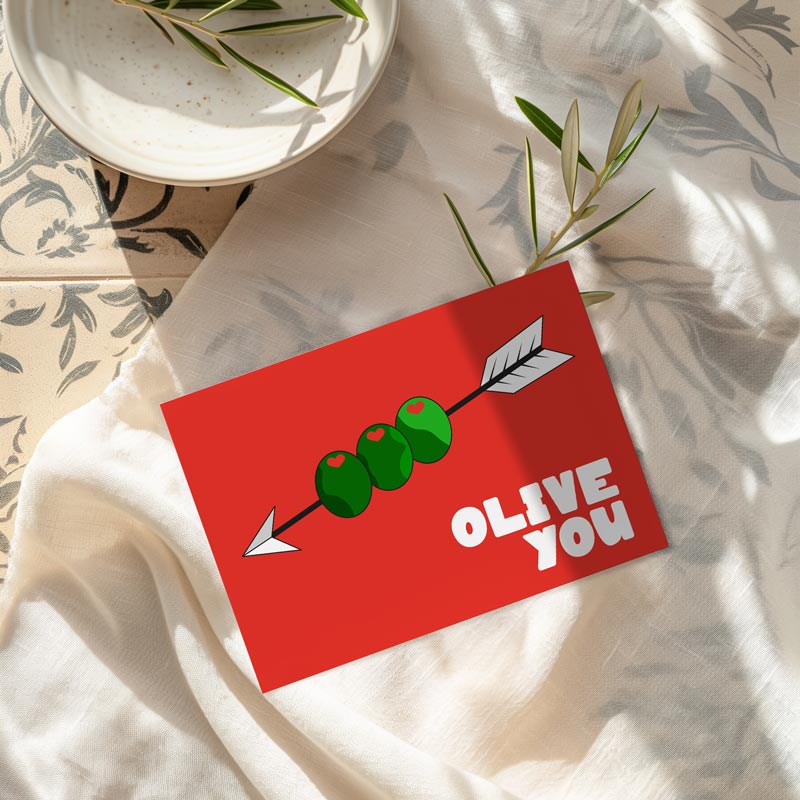 Affiche Olive You avec illustration graphique d’olives et message humoristique
