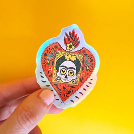 Sticker illustré inspiré de Frida Kahlo avec motifs floraux et symboliques
