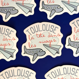 Sticker Toulouse la tête dans les nuages avec avions illustrés
