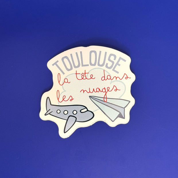 Sticker Toulouse la tête dans les nuages avec avions illustrés
